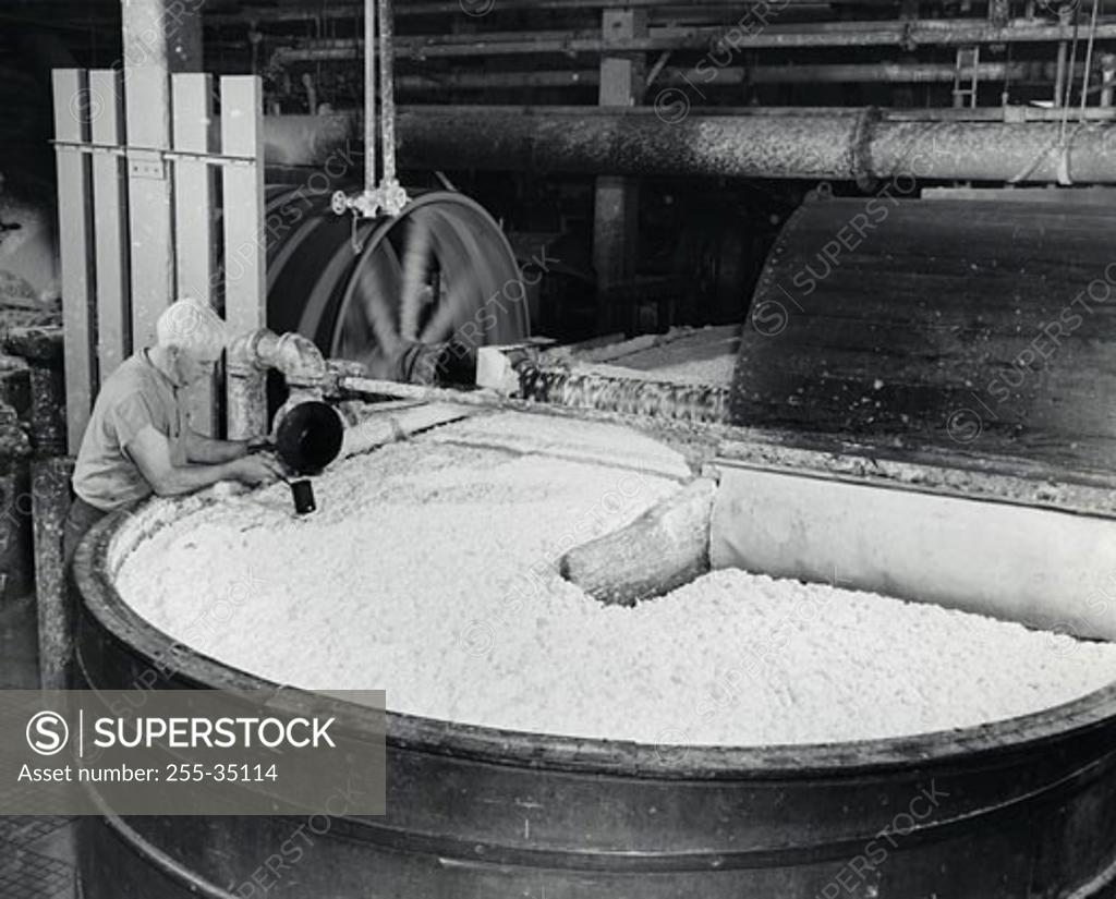 Stock Photo: 255-35114 High angle view of a worker working in a paper mill
