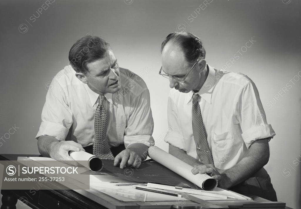Stock Photo: 255-37253 Two architects discussing a blueprint