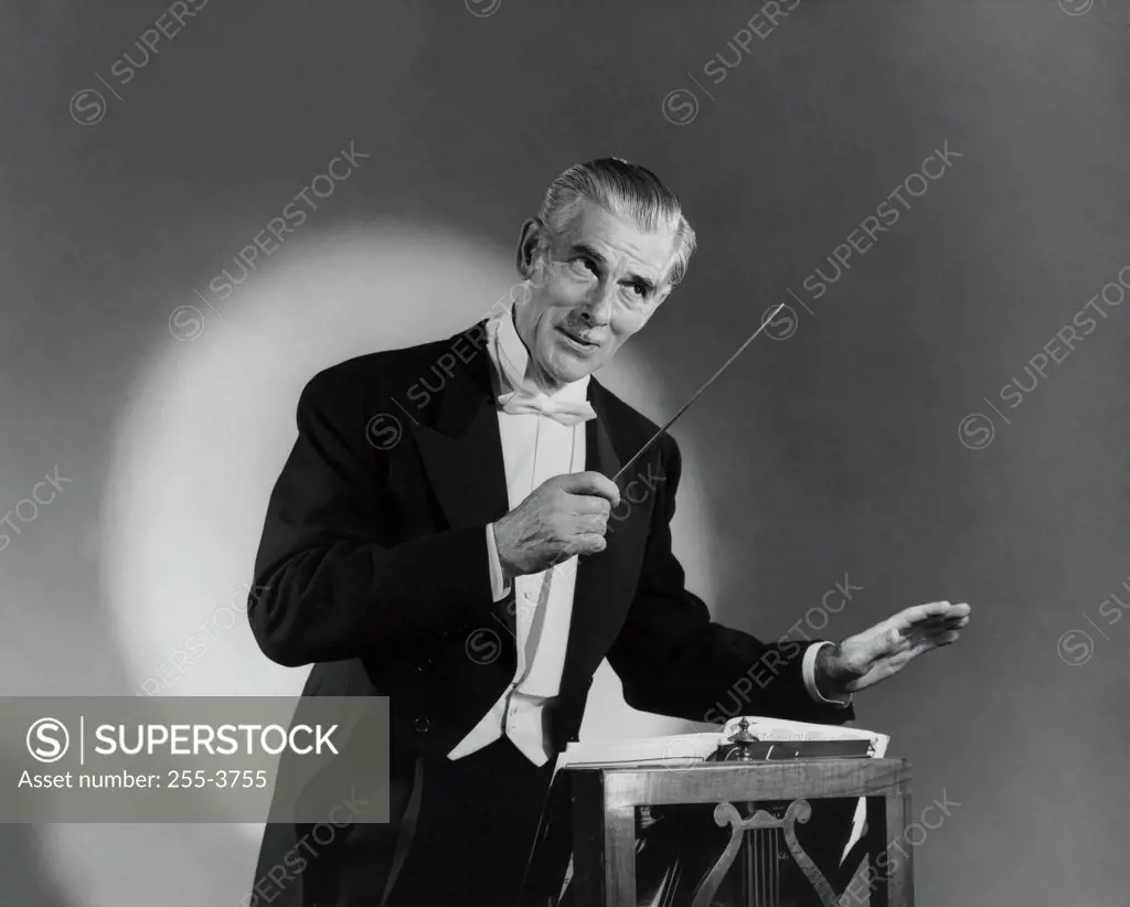 Close-up of a music conductor holding a conductor's baton