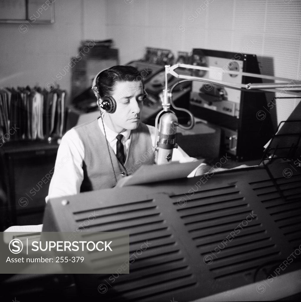Stock Photo: 255-379 Man sitting in radio station