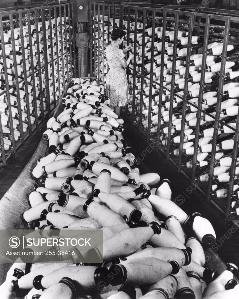 Stock Photo: 255-38416 High angle view of a female worker in a textile factory