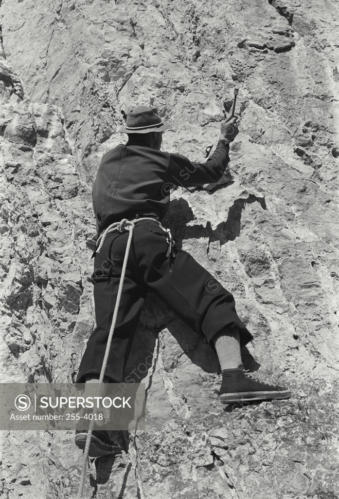 Stock Photo: 255-4018 Rear view of a man climbing on a mountain, Jackson Hole, Wyoming, USA