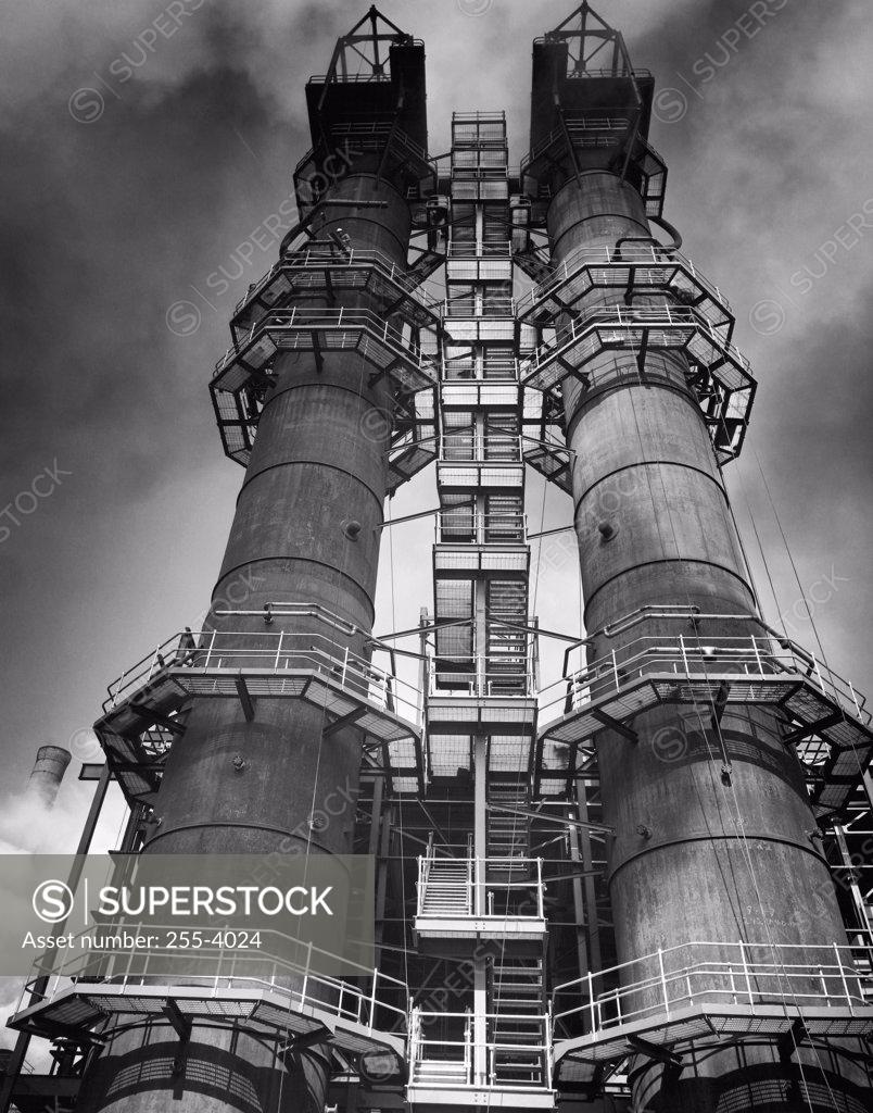 Stock Photo: 255-4024 Low angle view of two smoke stacks of a factory