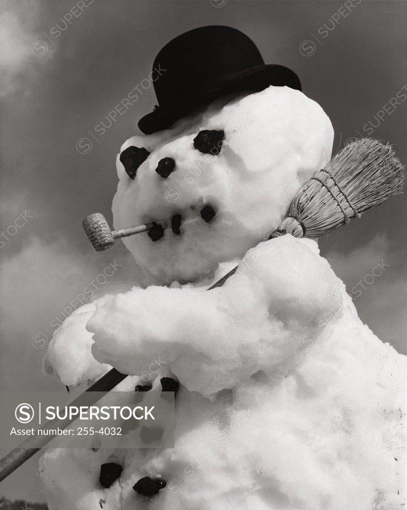 Stock Photo: 255-4032 Close-up of a snowman with a broom