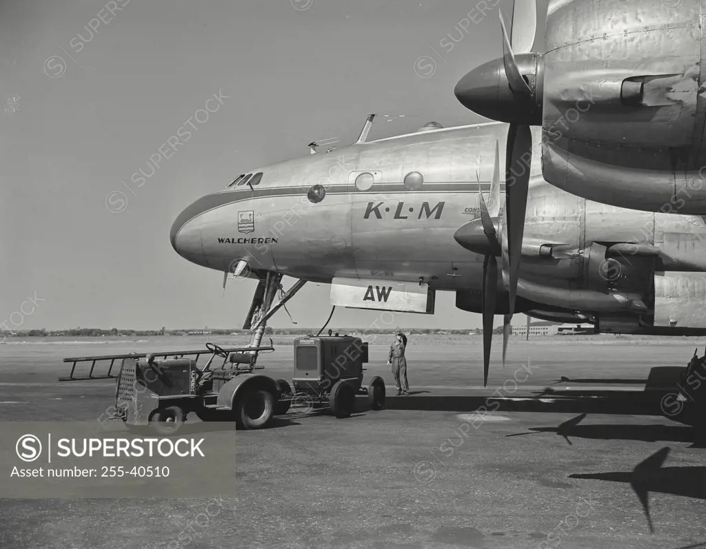Starting and warming engines of constellation overseas airliner, of the KLM Dutch Airlines, in preparation for flight overseas.