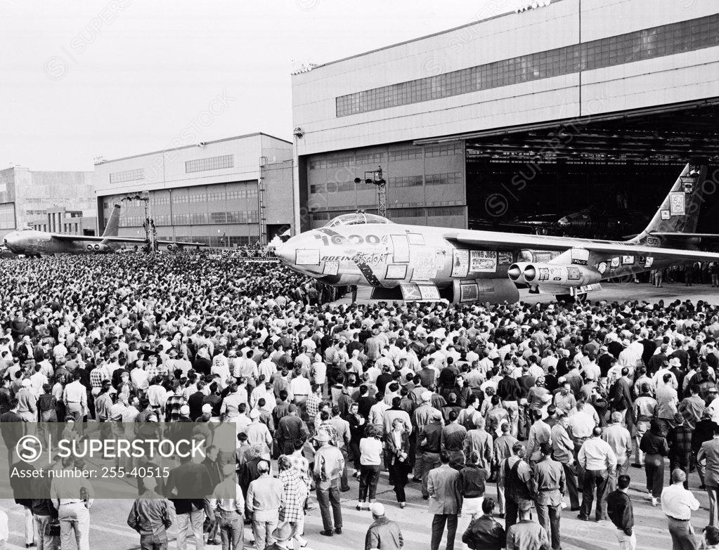 Stock Photo: 255-40515 High angle view of a group of people looking at a military airplane, B-47 Stratojet