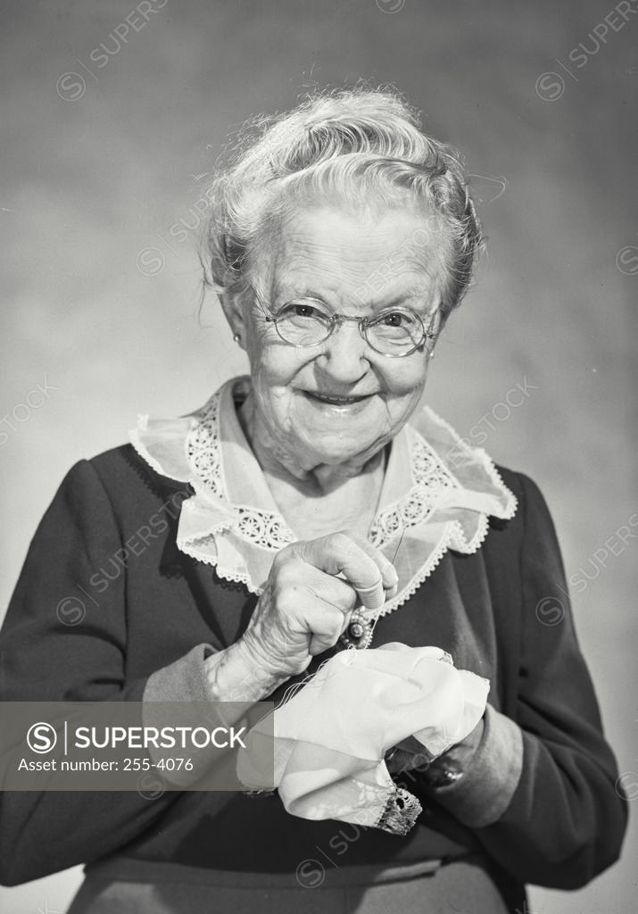 Stock Photo: 255-4076 Portrait of a senior woman sewing