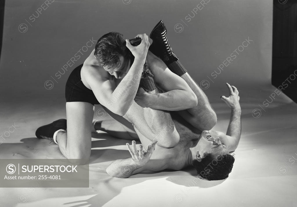 Stock Photo: 255-4081 Two mid adult men wrestling