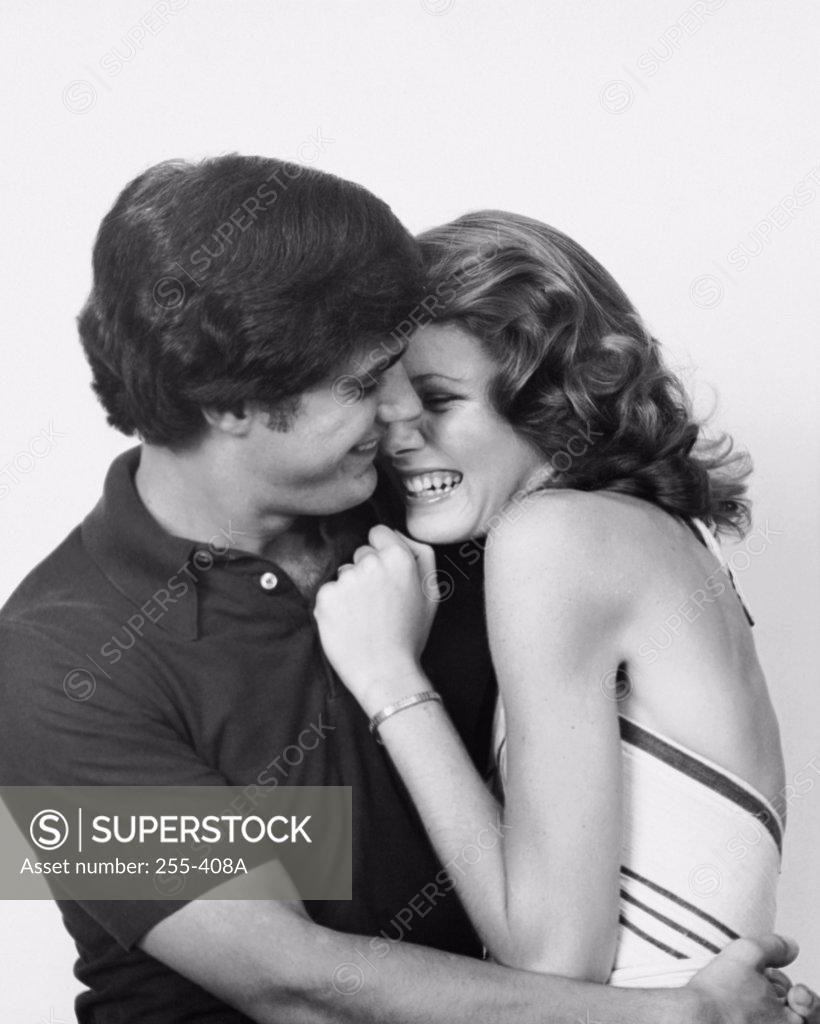 Stock Photo: 255-408A Young couple embracing each other