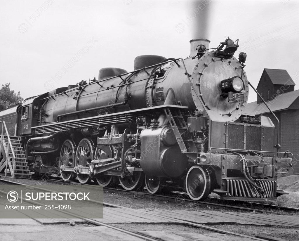 Stock Photo: 255-4098 Steam train on a railroad track