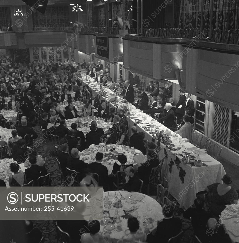 Stock Photo: 255-41639 High angle view of a group of people dining in a banquet hall