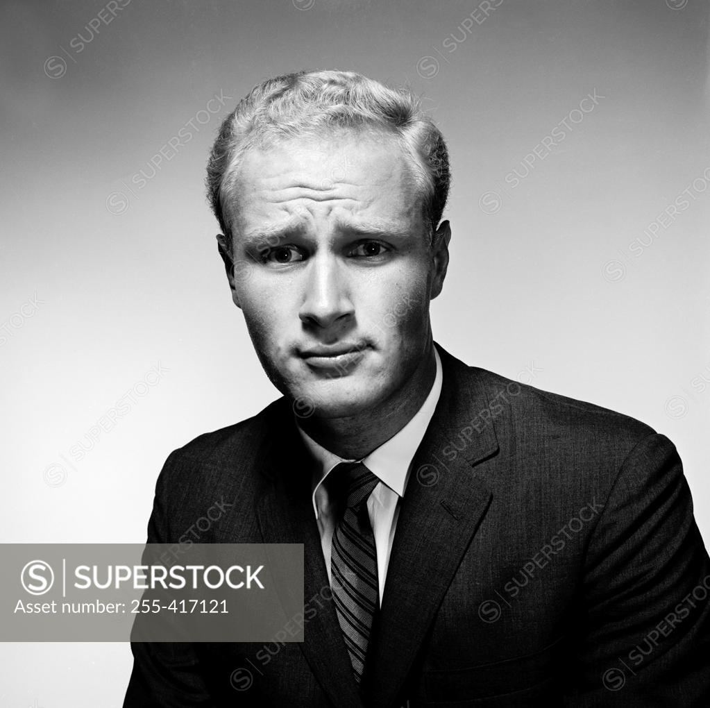 Stock Photo: 255-417121 Portrait of troubled young man wearing suit