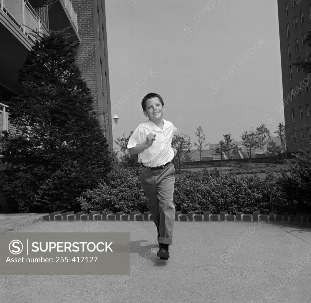 Boy running outdoors