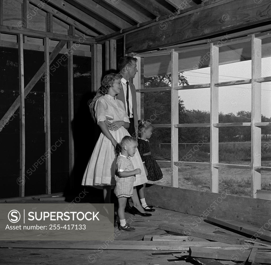 Stock Photo: 255-417133 Family with son and daughter contemplating future home