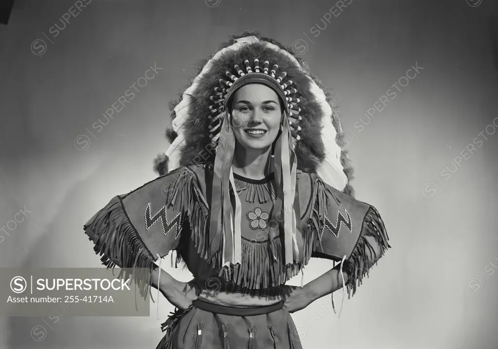 Vintage Photograph. Caucasian woman wearing Native American head dress. Frame 2