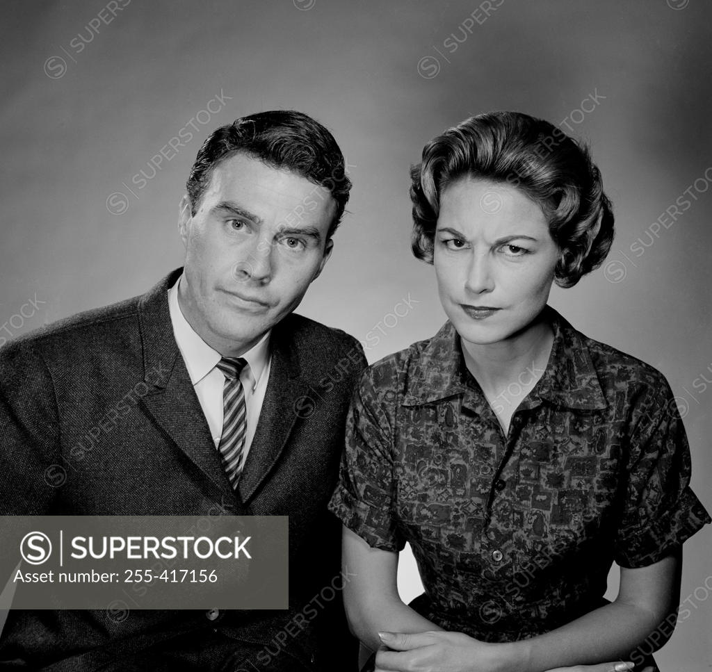 Stock Photo: 255-417156 Studio portrait of unhappy couple