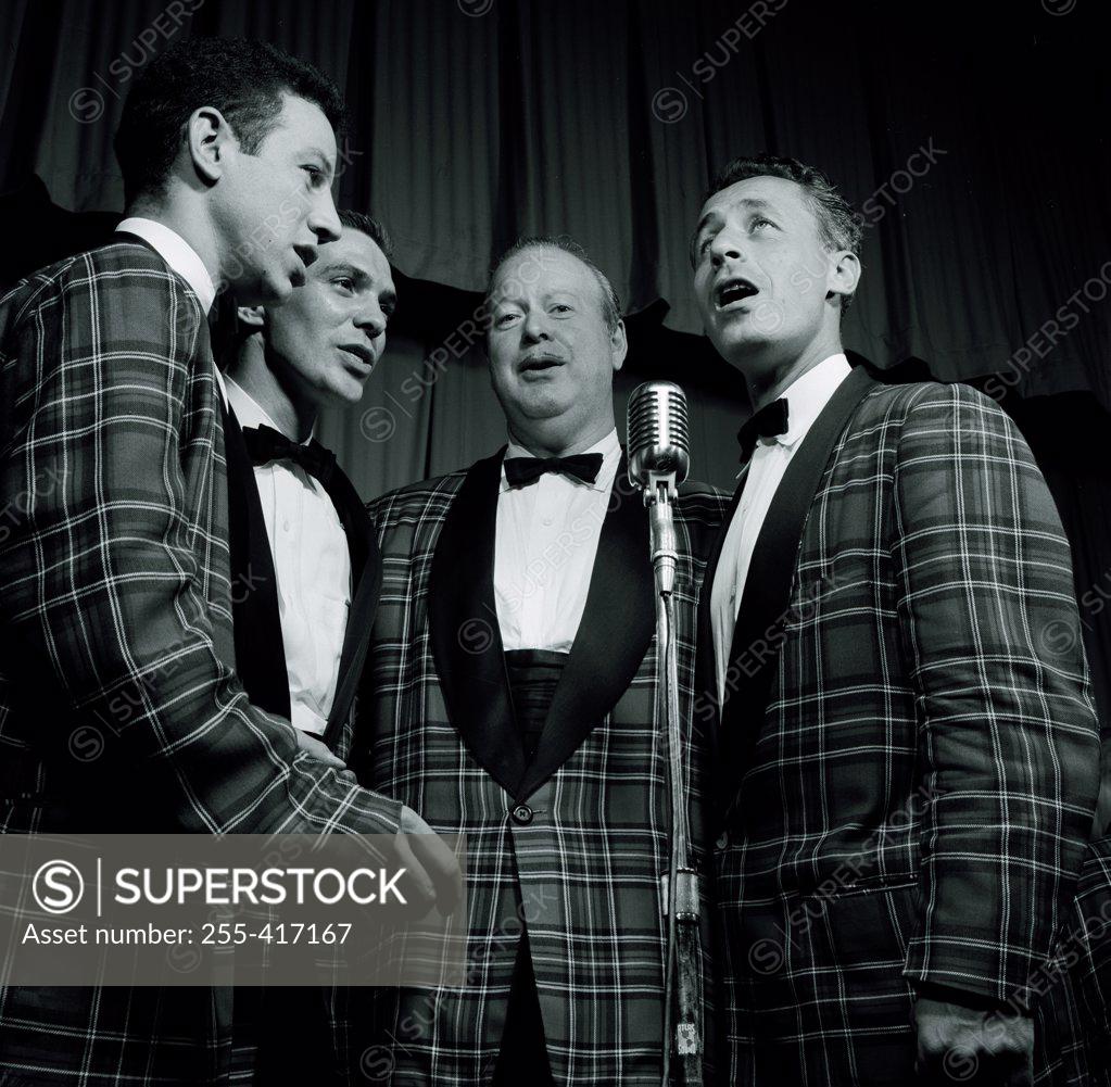 Stock Photo: 255-417167 Entertainment group singing on stage