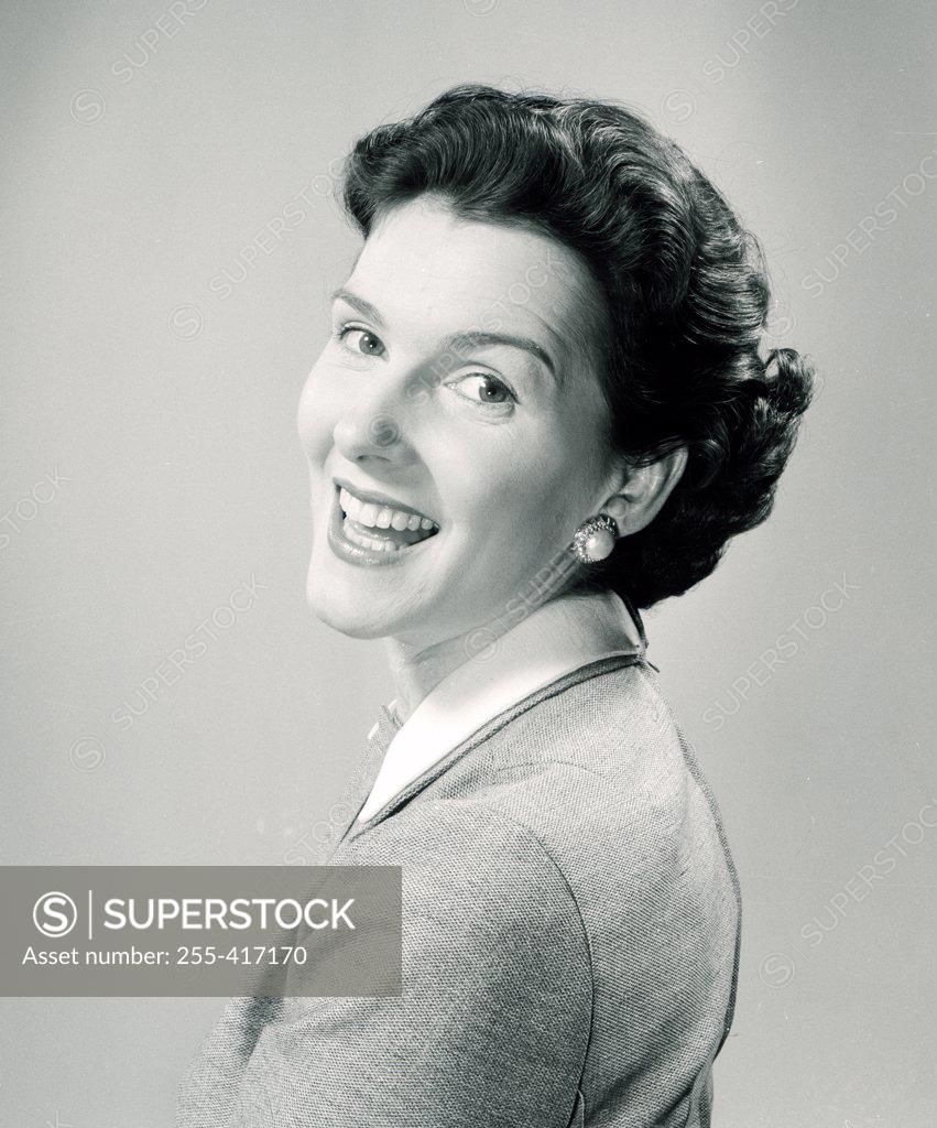 Stock Photo: 255-417170 Studio portrait of smiling woman