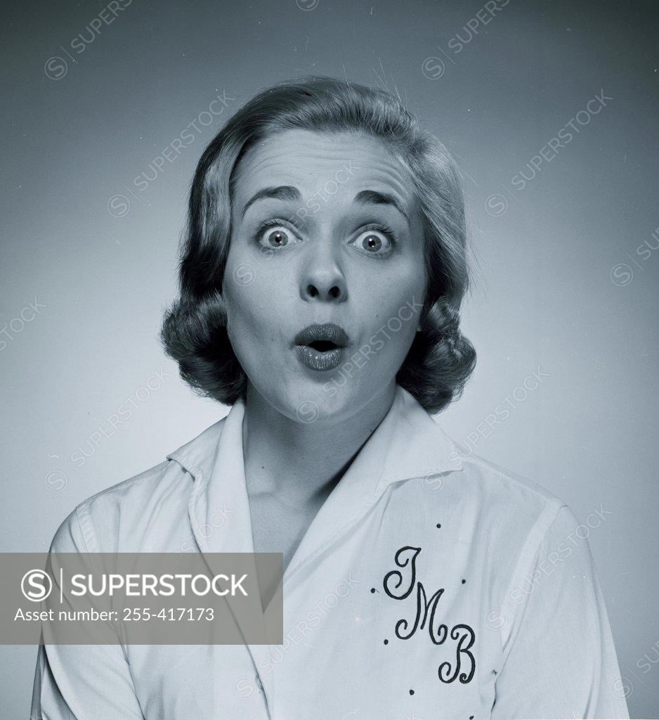 Stock Photo: 255-417173 Studio portrait of surprised woman