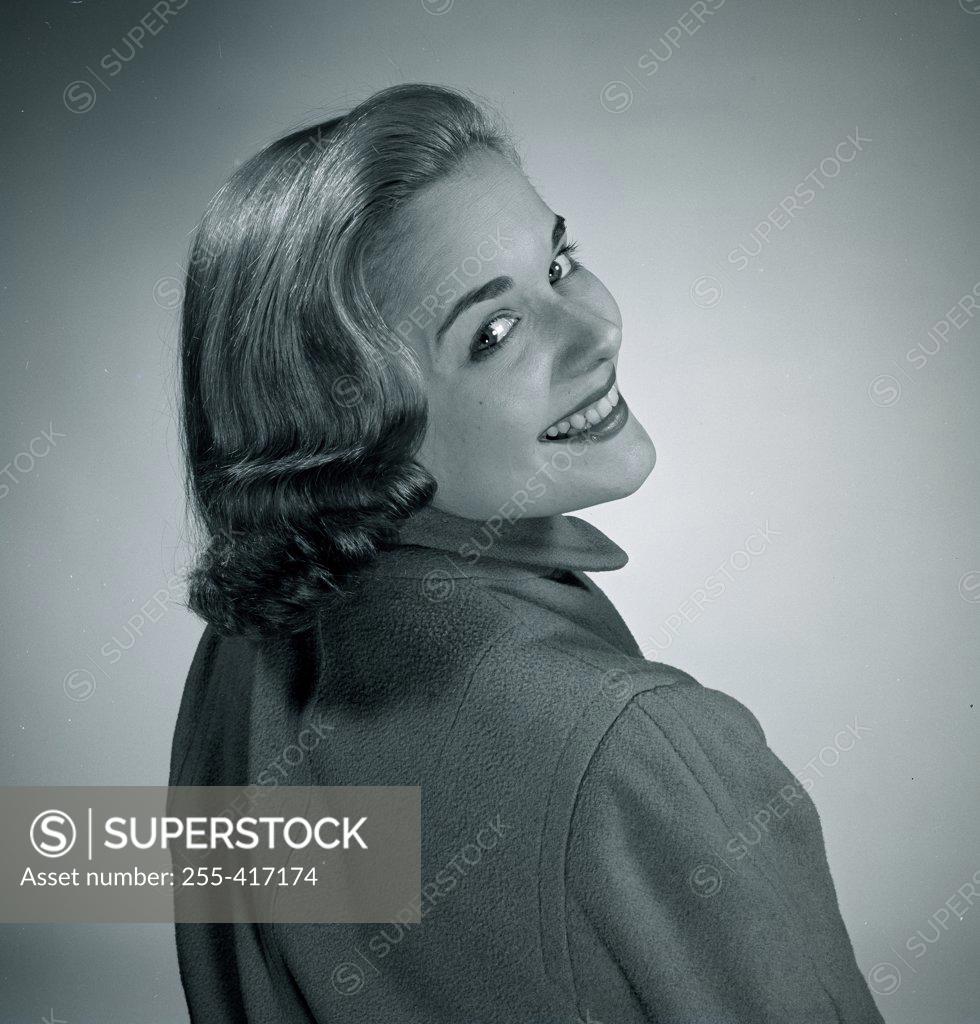 Stock Photo: 255-417174 Studio portrait of smiling woman