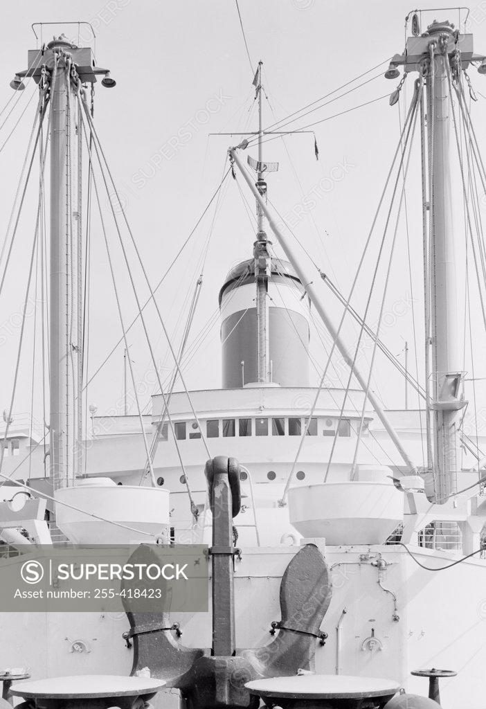 Stock Photo: 255-418423 Anchor on deck, passenger ship in the background