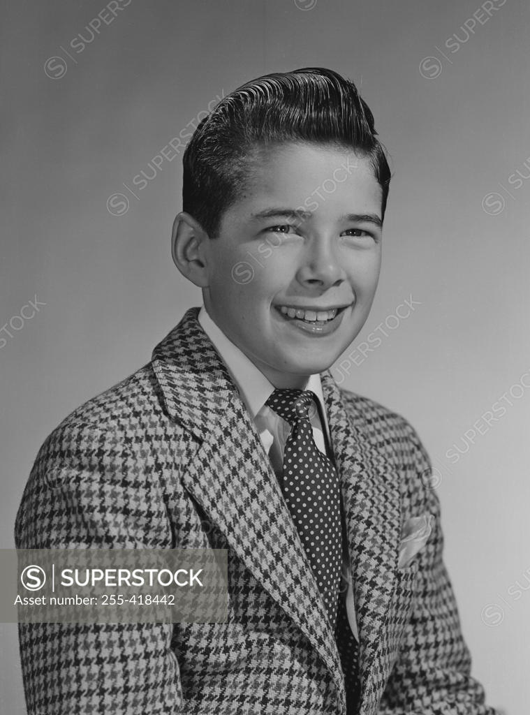 Stock Photo: 255-418442 Portrait of boy in pepita jacket and tie