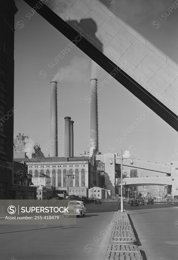 Stock Photo: 255-418479 Factory with smoking chimneys, road in the foreground