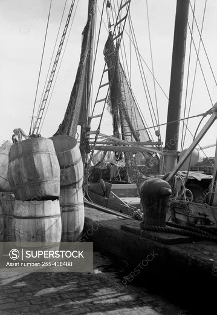Stock Photo: 255-418488 Moored yacht with wooden barrels