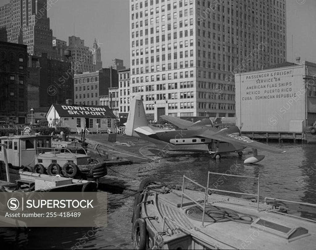 Stock Photo: 255-418489 USA, New York State, New York City, Downtown New York City Skyport, amphibious aircraft taking off