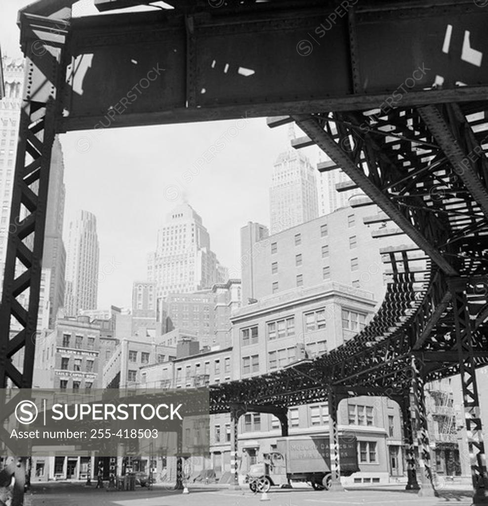 Stock Photo: 255-418503 USA, New York State, New York City, Manhattan, Skyscrapers with elevated railroad track on the foreground