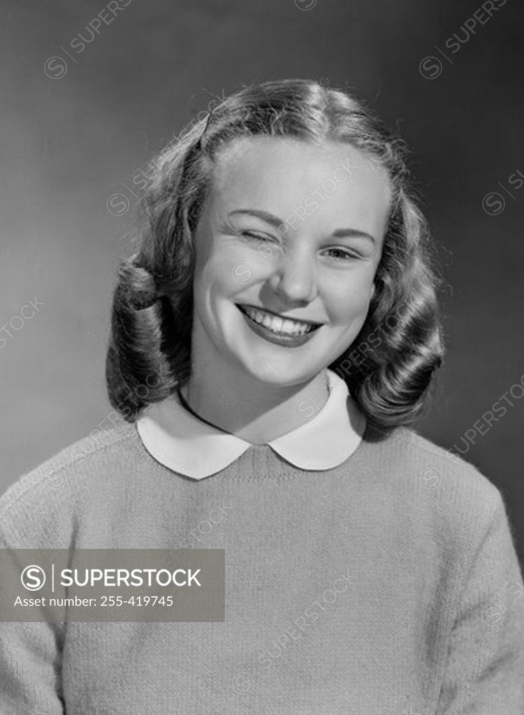 Stock Photo: 255-419745 Portrait of girl smiling and winking