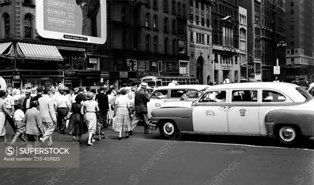 Stock Photo: 255-419825 USA, New York State, New York City, Crowds crossing Fifth avenue at 42nd Street