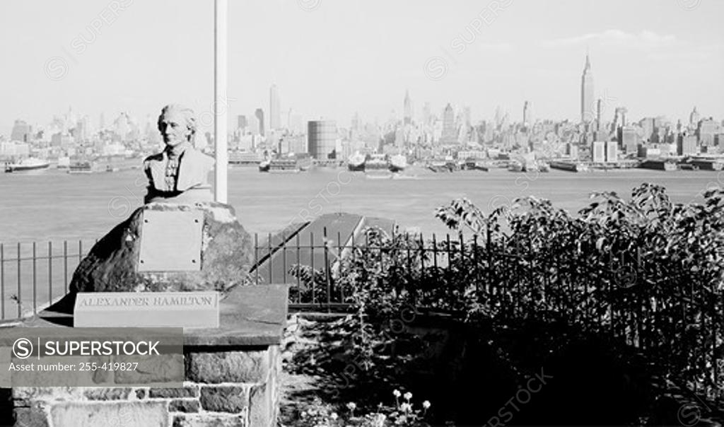 Stock Photo: 255-419827 USA, New York State, New York City, View looking past Alexander Hamilton Memorial toward skyline of Midtown Manhattan