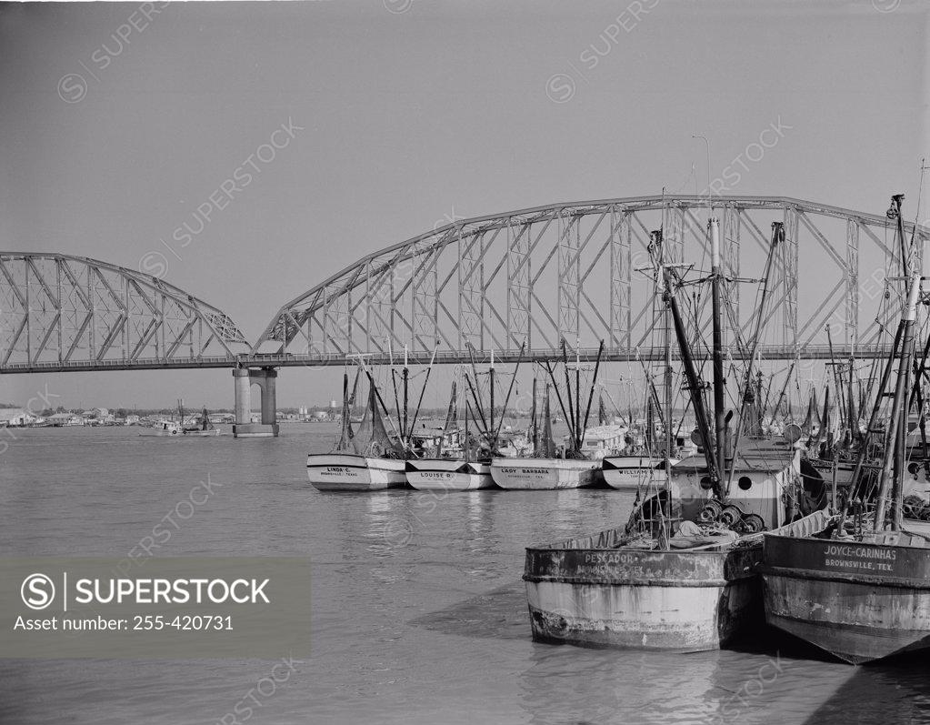 Stock Photo: 255-420731 USA, Louisiana, Morgan City, Port with moored boats and bridge in the background