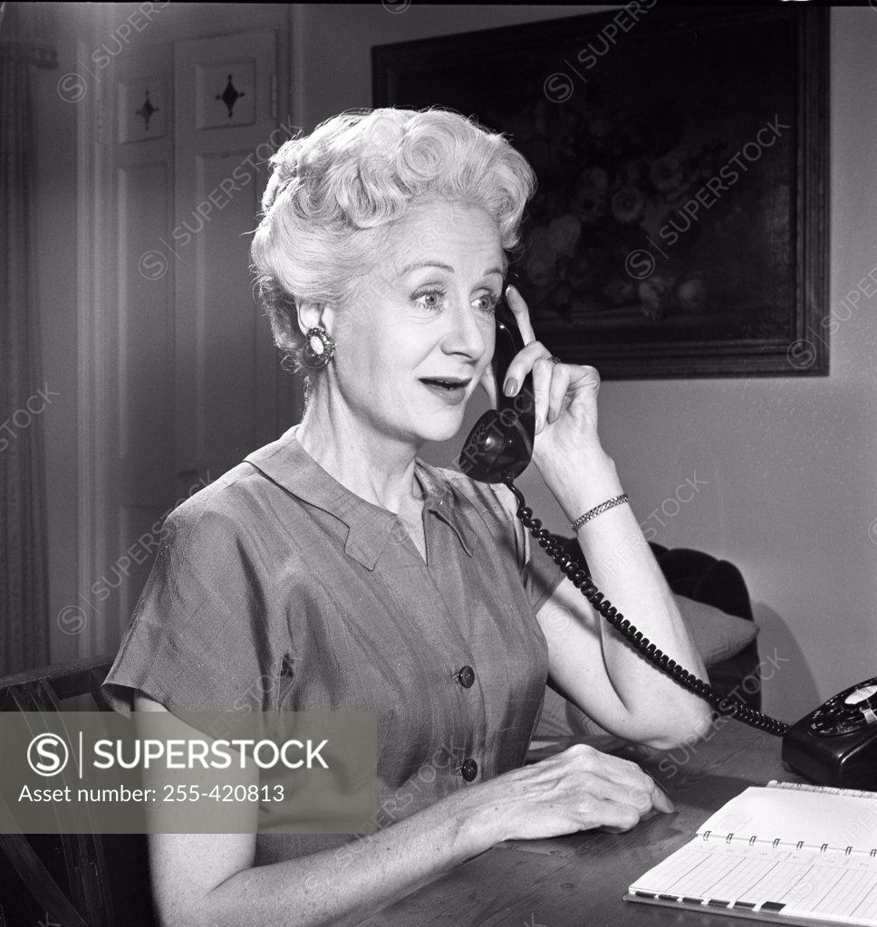 Stock Photo: 255-420813 Mature woman talking on the phone