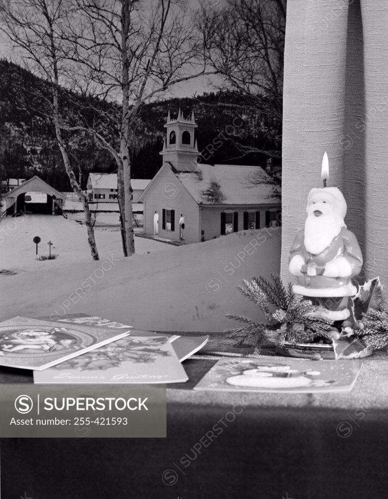 Stock Photo: 255-421593 Church and covered bridge seen through Christmas window