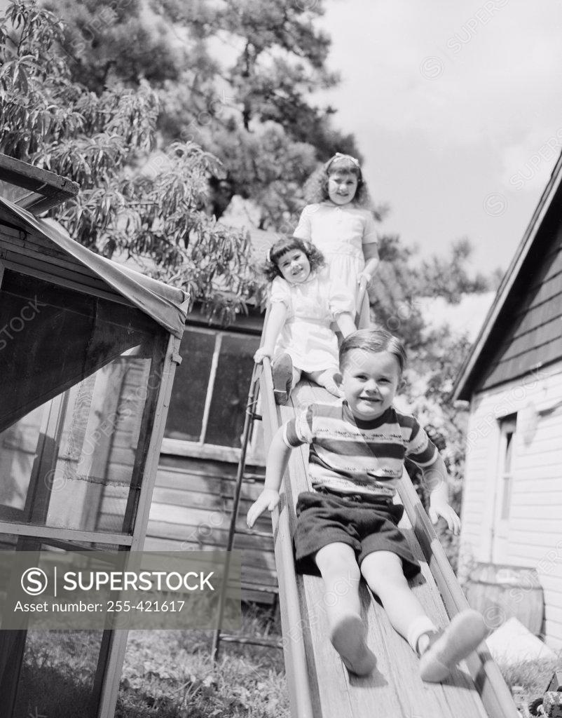 Stock Photo: 255-421617 Children on slide