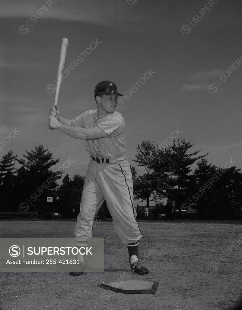 Stock Photo: 255-421631 Baseball player holding bat and waiting for ball