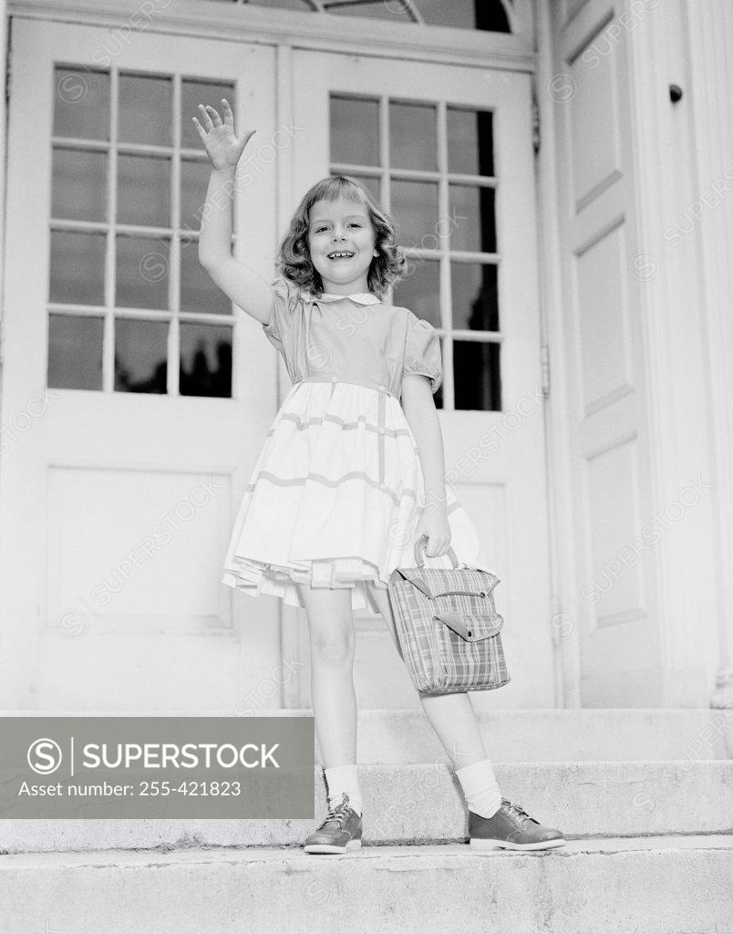 Stock Photo: 255-421823 Girl waving from porch