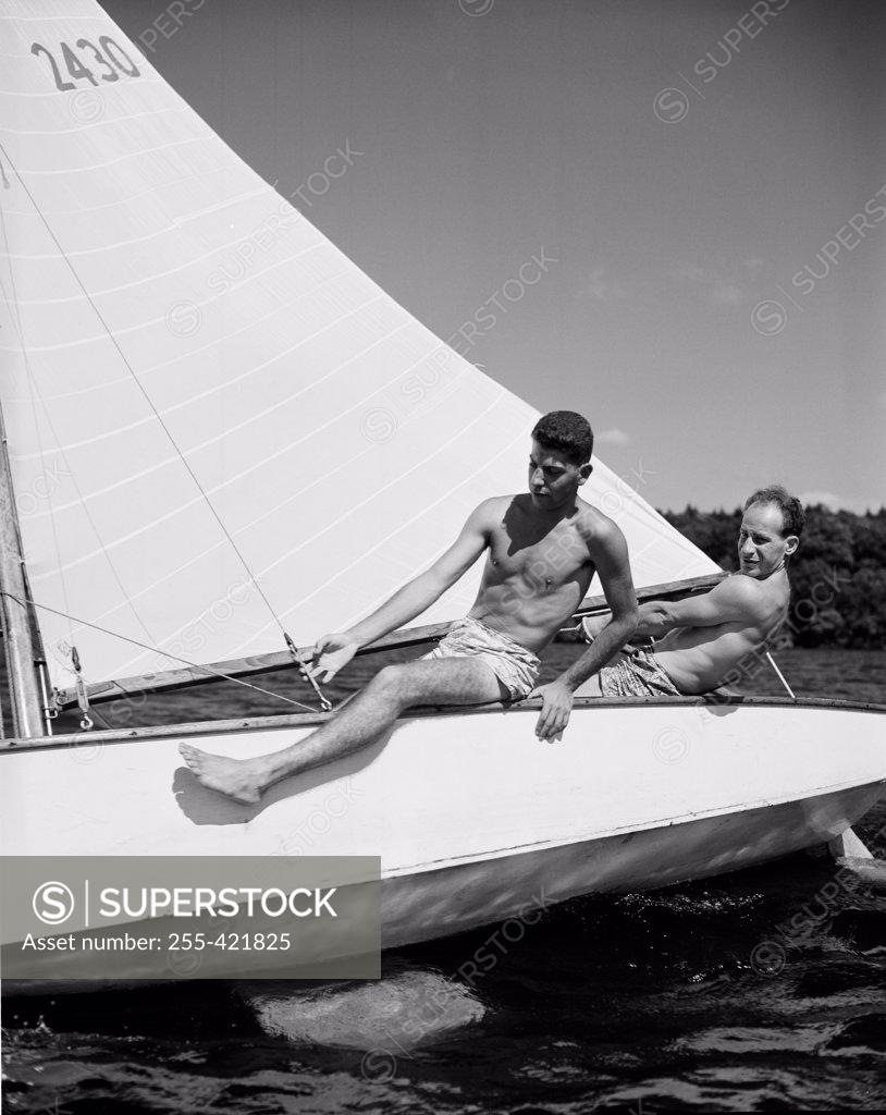 Stock Photo: 255-421825 Two men on sailboat