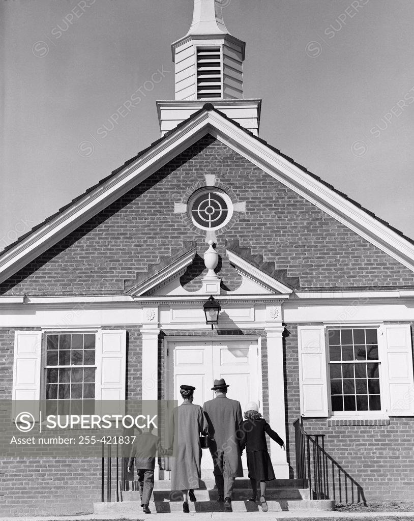 Stock Photo: 255-421837 Parents with children in front of church
