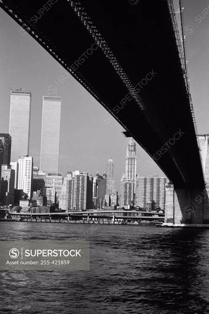 USA, New York City skyline viewed from underneath Brooklyn Bridge