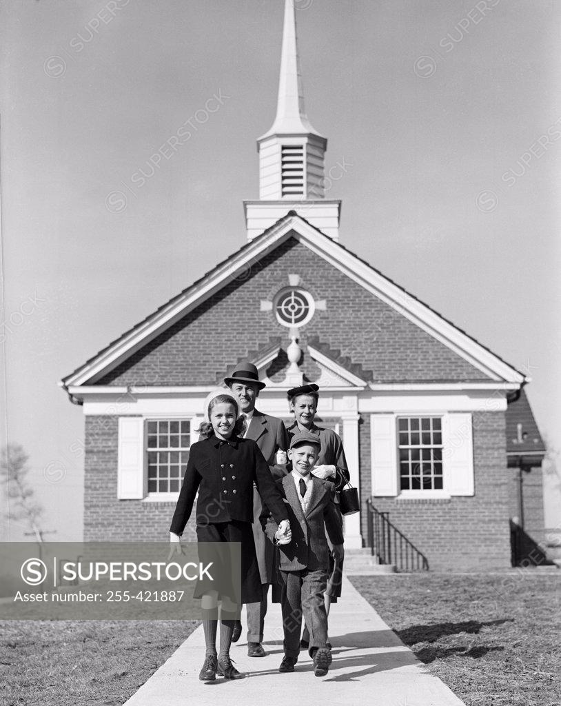 Stock Photo: 255-421887 Parents with children in front of church