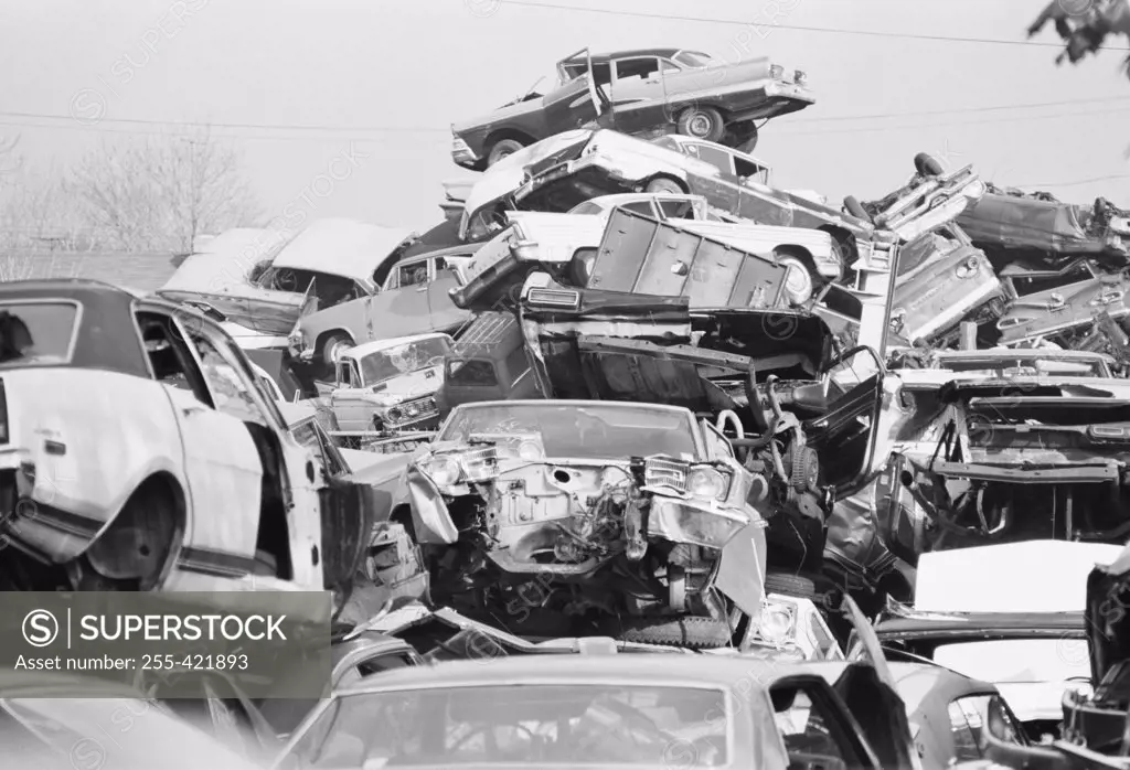 Stacks of cars in junkyard