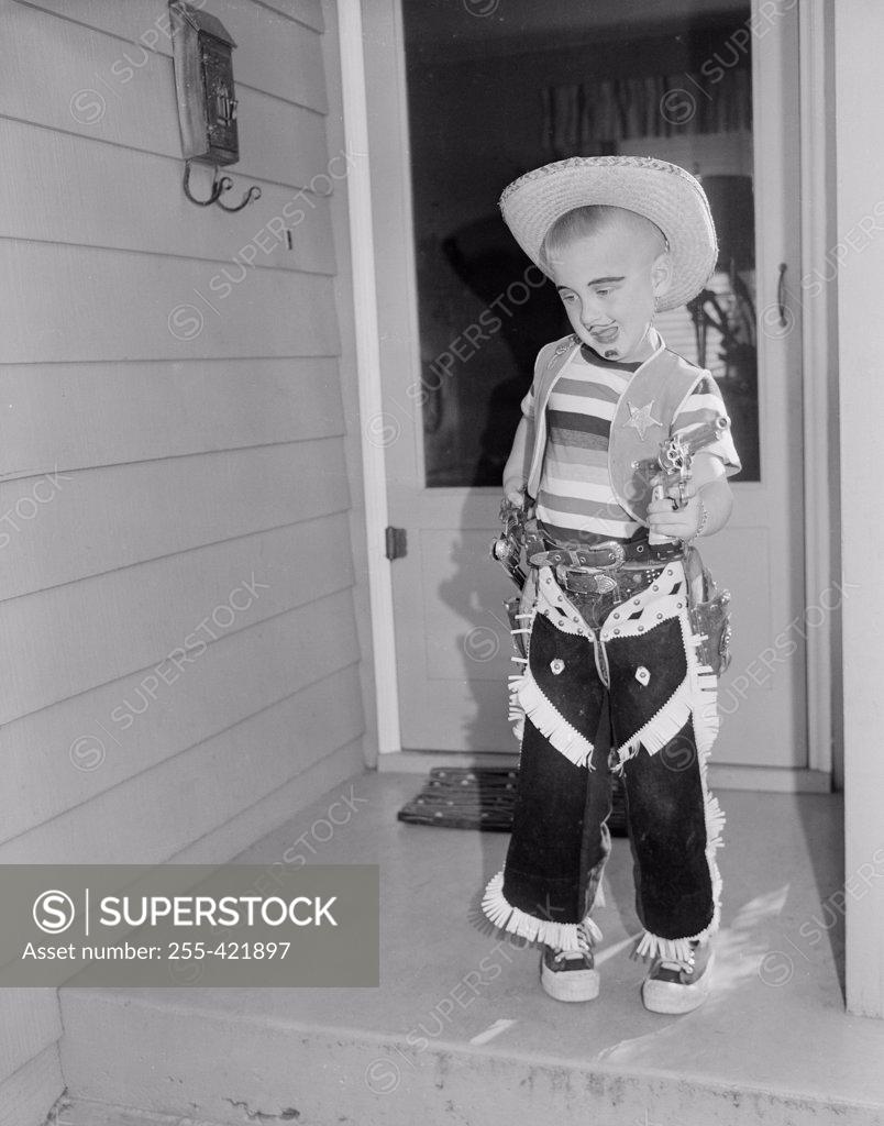 Stock Photo: 255-421897 Boy wearing cowboy costume