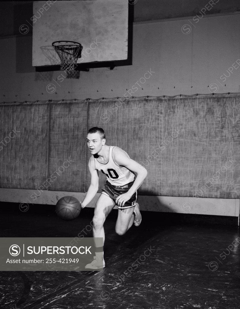 Stock Photo: 255-421949 Man playing basketball