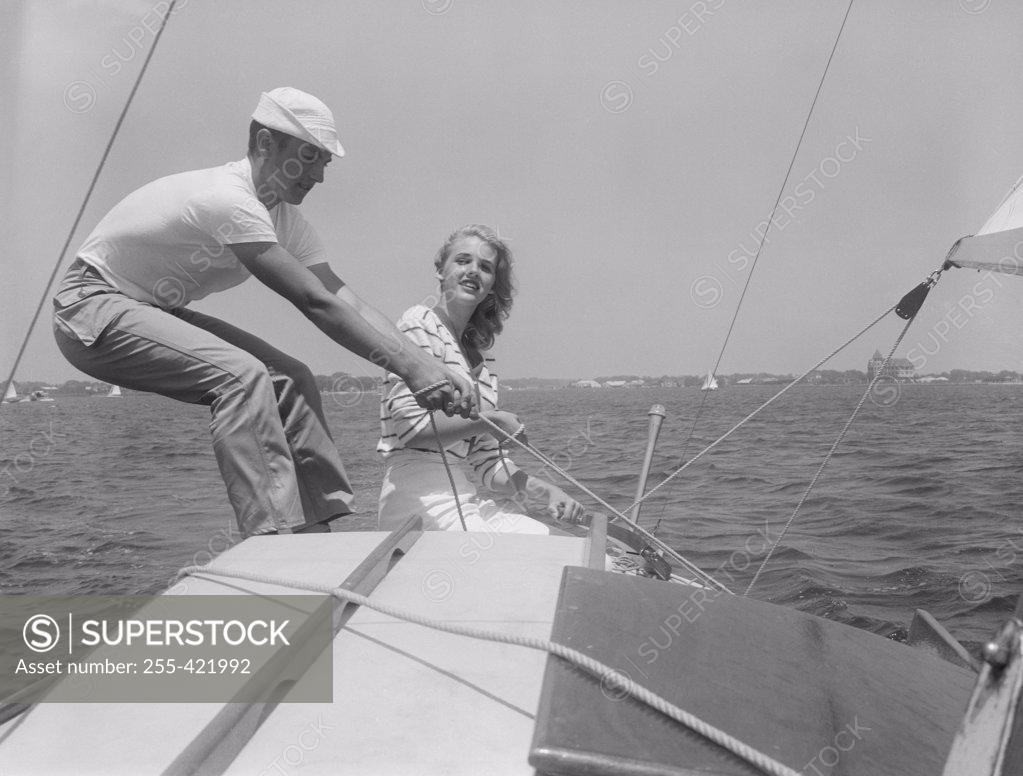 Stock Photo: 255-421992 Couple on yacht sailing together