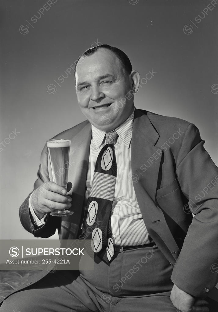 Stock Photo: 255-4221A Portrait of mature man holding glass of beer