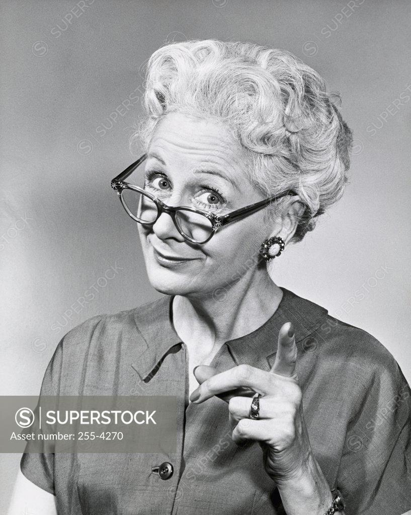 Stock Photo: 255-4270 Portrait of a senior woman pointing forward