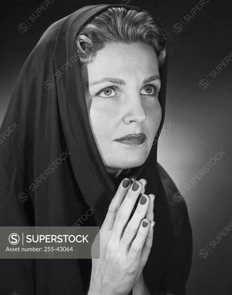 Stock Photo: 255-43064 Close-up of a mid adult woman praying